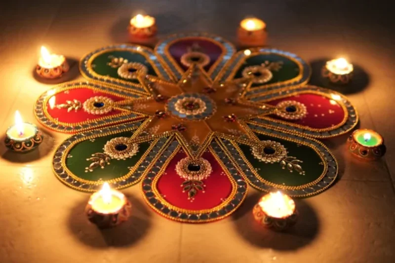 Rangoli topped with diyas 